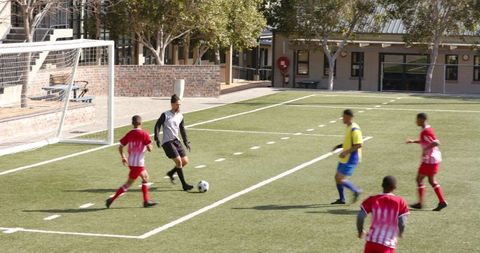 Youth Soccer Match Exhibiting Teamwork and Strategy on Field