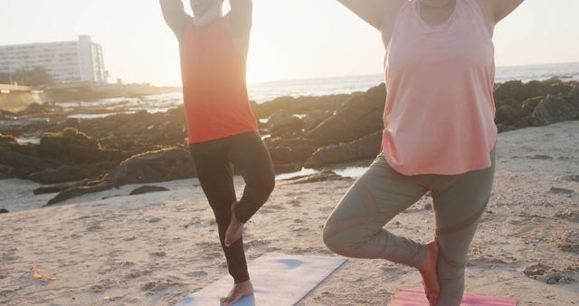 People Practicing Yoga on Beach during Sunrise, Relaxing Morning Exercise - Download Free Stock Images Pikwizard.com