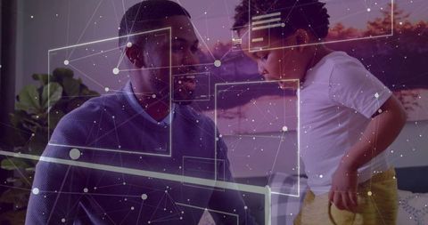 Father and Son Viewing Network Overlay on Monitor