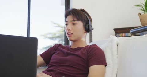 Teenager Enjoying Music and Laptop at Home - Download Free Stock Images Pikwizard.com