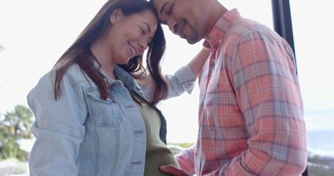 Expectant couple cherishing moment of connection and anticipation