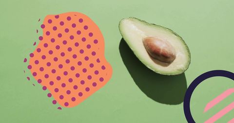 Creative composition with halved avocado on vibrant background