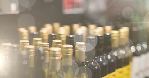 wine bottles display with elegant bokeh lights - Download Free Stock Images Pikwizard.com
