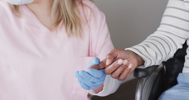 Caregiver in Pink Uniform Holding Elderly Patient's Hand for Support - Download Free Stock Images Pikwizard.com