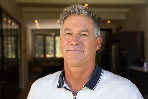 Confident Senior Man Relaxing in Stylish Modern Home
