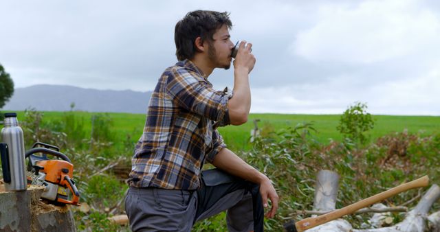Side view of lumberjack drinking water in the forest 4k - Download Free Stock Photos Pikwizard.com