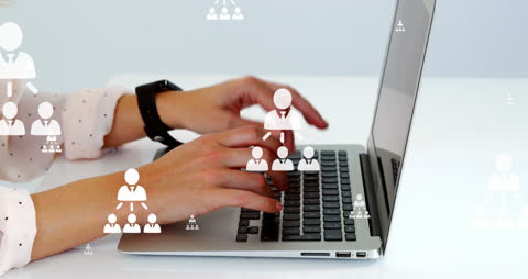 Businesswoman Typing with Flowcharts Overlayed on Laptop