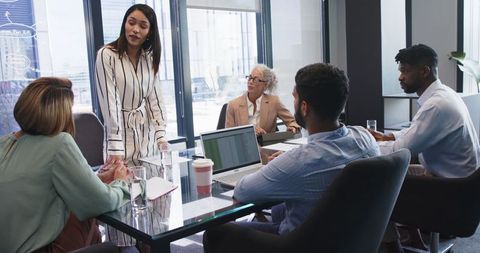 Diverse business team discussing strategic project in modern office