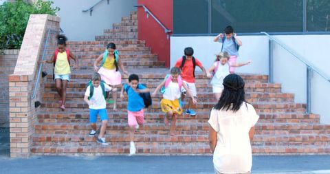 Children Running Towards Teacher at School Entrance - Download Free Stock Images Pikwizard.com