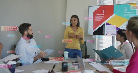 Team presenting with digital data overlays, woman leading meeting, presentation on screen