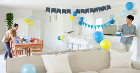 Family Birthday Celebration with Cake and Festive Decorations