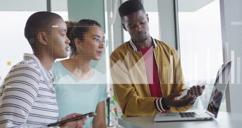 Diverse Team Analyzing Data within Modern Office Environment