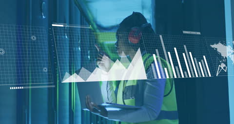 IT Professional Analyzing Data with Interactive Graphics in Server Room