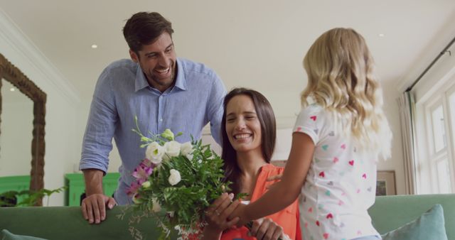 Family Celebrating Special Moment with Flowers at Home - Download Free Stock Images Pikwizard.com