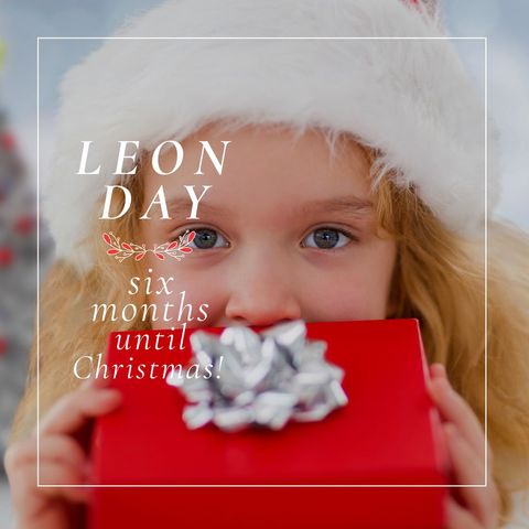 Excited Child Holding Gift Box for Leon Day Celebration - Download Free Stock Templates Pikwizard.com
