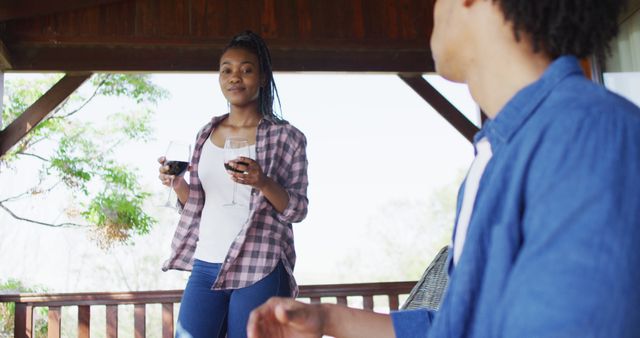 African American Friends Enjoying Wine on Outdoor Terrace - Download Free Stock Images Pikwizard.com