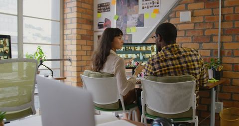 Diverse Creative Team Collaborating on Design Project in Office