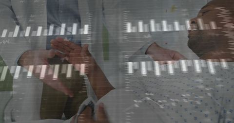 Doctor monitoring patient vital signs with analytics layered chart