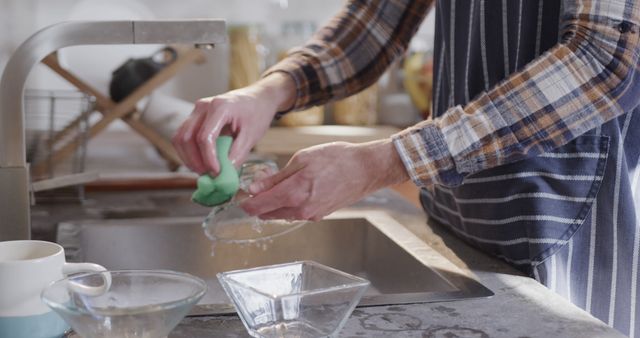 Man Washing Dishes in Kitchen Sink Wearing Plaid Shirt - Download Free Stock Images Pikwizard.com