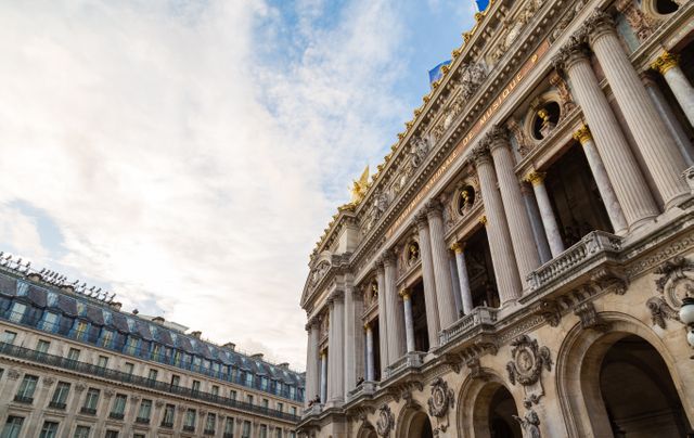 Classic architecture of Paris Opera House with ornate details against a clear blue sky. Ideal for travel blogs, architecture studies, tourism websites, and historical presentations.