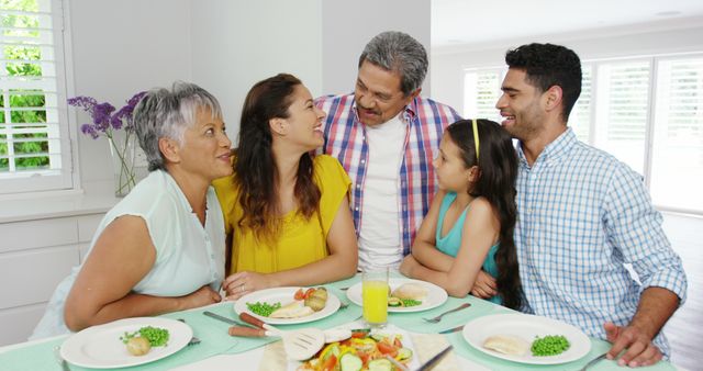 Happy Multigenerational Family Enjoying Meal Together at Home - Download Free Stock Images Pikwizard.com