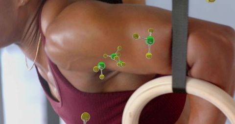 Woman performing ring support hold building upper-body strength and shoulder stability