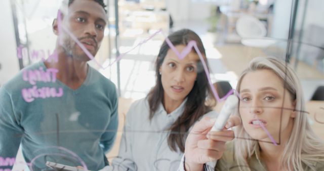 Diverse Business Team Analyzing Data on Glass Board in Office - Download Free Stock Images Pikwizard.com