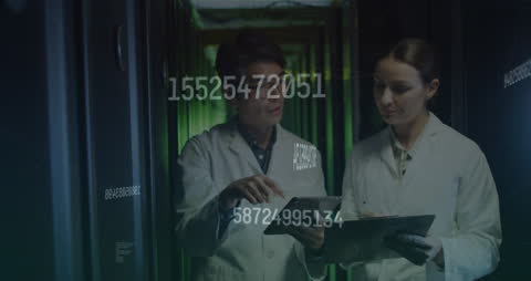 Technicians Analyzing Data in Advanced Server Room
