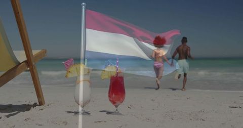 Tropical beach romance with flag and exotic cocktails