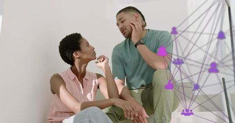 Couple Discussing on Stair Landing with Digital Network Overlay Representing Connectivity