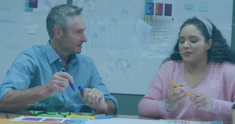 Diverse Team Analyzing Data in Office Environment