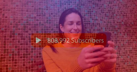 Woman Celebrating Social Media Milestone on Smartphone