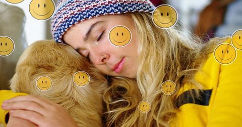 Woman in Beanie Relaxing with Her Golden Retriever Puppy at Home