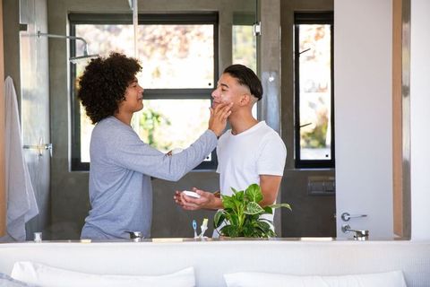 Diverse Friends Enjoying Skincare Routine in Modern Bathroom