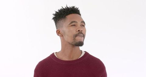 Young Man in Red Sweater Reflecting on Life