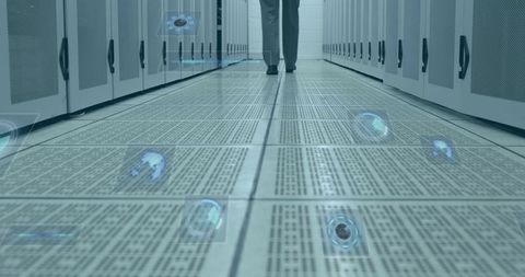 Man Walking in Secure Server Room with Cybersecurity Theme