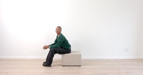 African American Man Relaxing in Minimalist Living Room - Download Free Stock Images Pikwizard.com