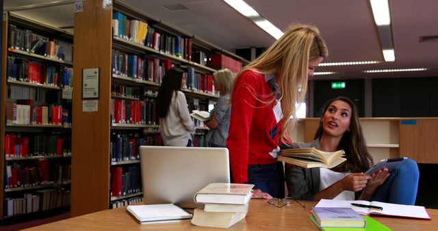 Students Studying Together in Library with Books and Laptop - Download Free Stock Images Pikwizard.com