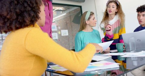 Diverse Team in Creative Discussion at Fashion Office