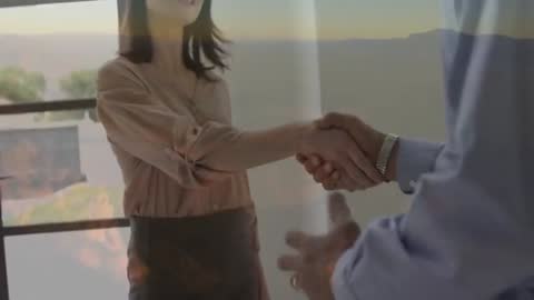 Business Professionals Shaking Hands with Animated Background