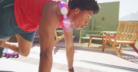 Fit African American Man Exercising in Sunlit Home