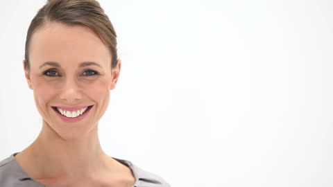 Smiling Woman Facing Camera in Bright Setting