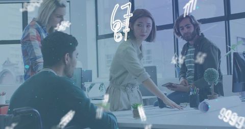 Female designer leading collaborative blueprint review in bright open-plan office