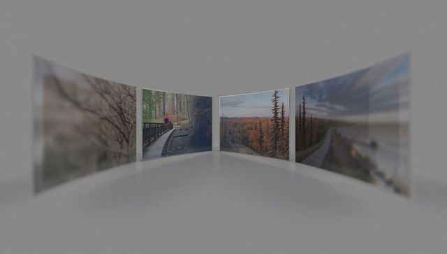 Curved gallery panels showing autumn forest and coastal boardwalk with person in red jacket