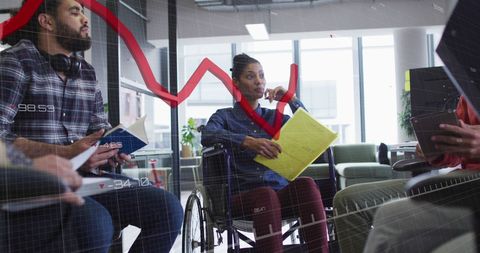 Diverse business meeting with data analytics visualization