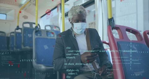 Businessman with face mask using smartphone on bus commute