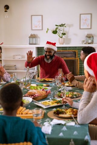 Festive Family Celebrating Christmas Meal in Cozy Home