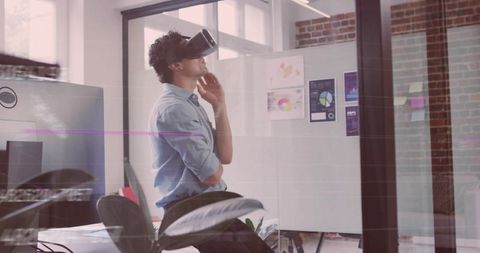 Man Exploring Virtual Reality in Modern Tech Office