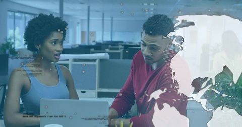 Colleagues Collaborating with Digital Data in Modern Office