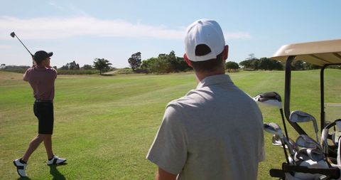Golf Enthusiasts Enjoying a Sunny Day Outdoors - Download Free Stock Images Pikwizard.com